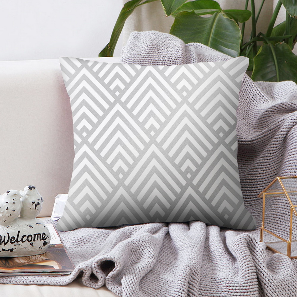 pink and grey geometric cushion